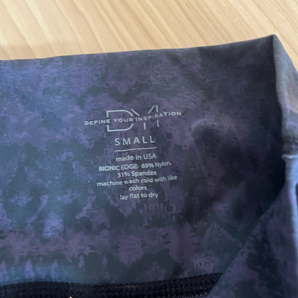 Purple and black “Define Your Inspiration” leggings